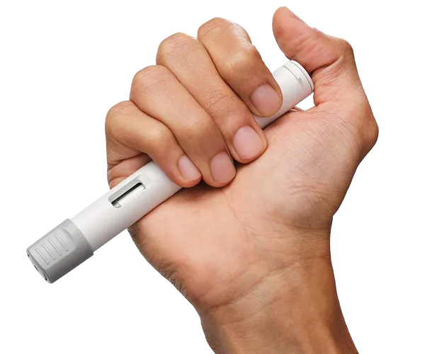 Hand holding medical pen